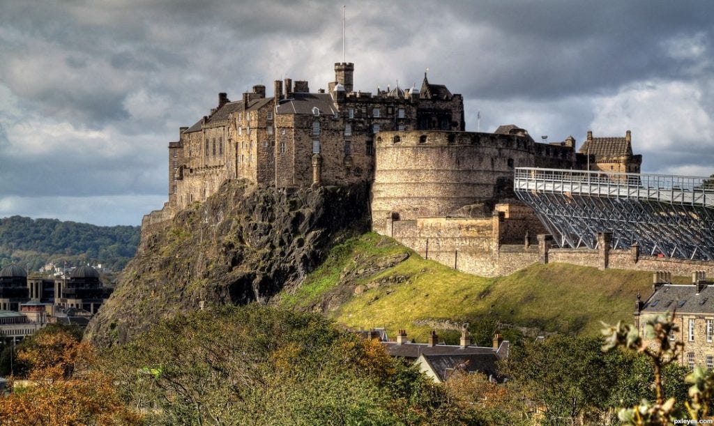 Edinburgh Castle high on the hill overlooking the city. a great place to start a wlking tour.