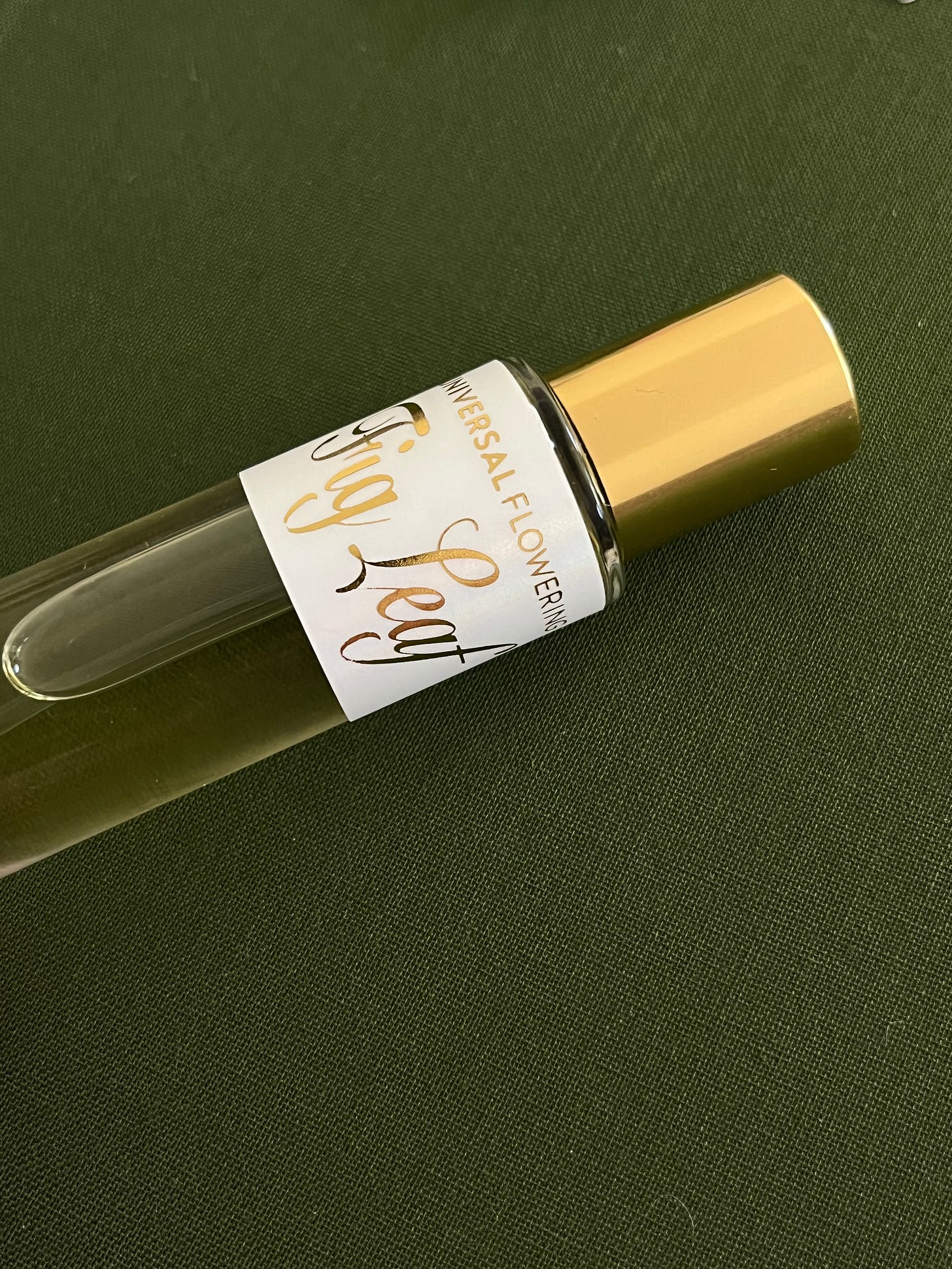 Perfume bottle labeled "Universal Flowering Fig Leaf"