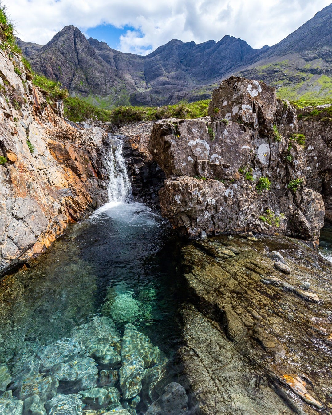 May be an image of mountain, waterfall and nature