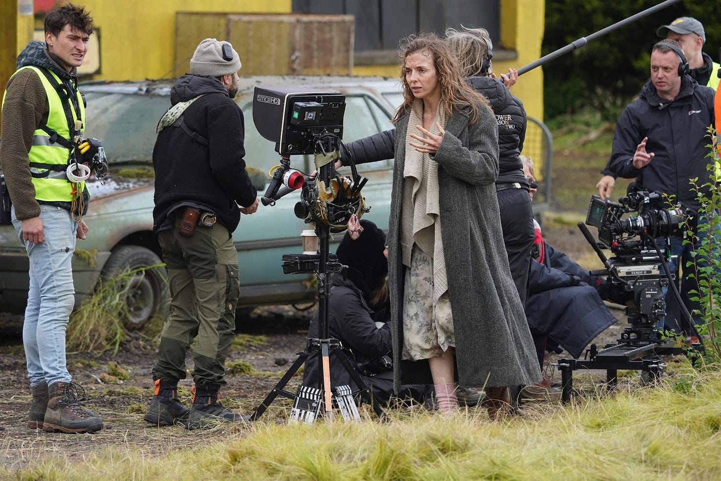 Image may contain Jodie Comer Clothing Hat Person Teen Tripod Footwear Shoe Adult Glove Car and Transportation