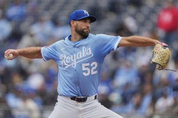 Kansas City Royals starting pitcher Michael Wacha throws during the first inning of a baseball game against the Cleveland Guardians, Sunday, March 30, 2025, in Kansas City, Mo. (AP Photo/Charlie Riedel)