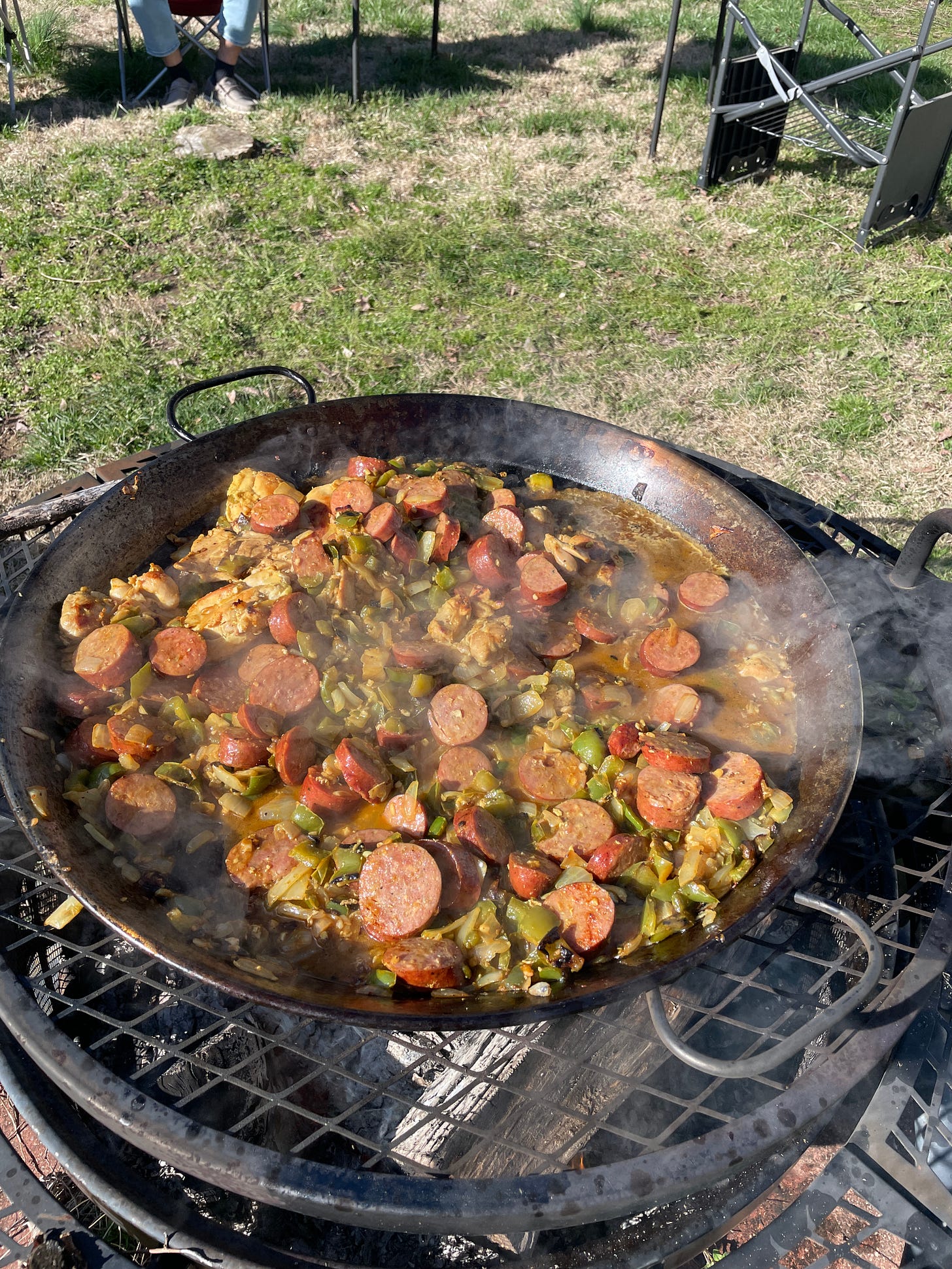 Paella in pan over open fire