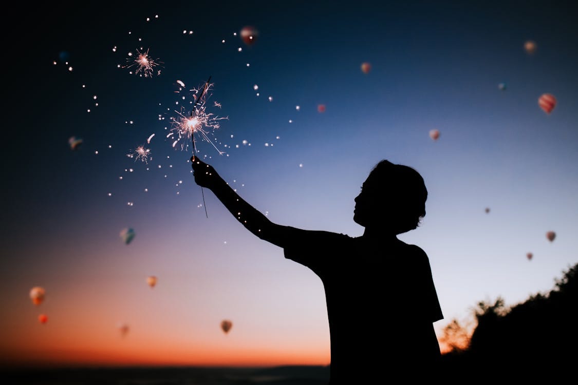 Free Person Holding Sparkler Silhouette Stock Photo