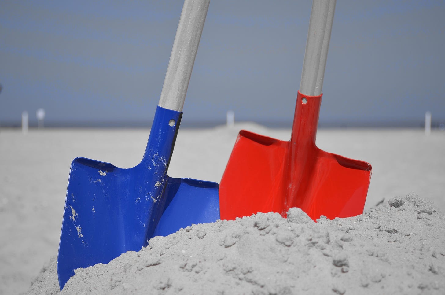Shovels in sand