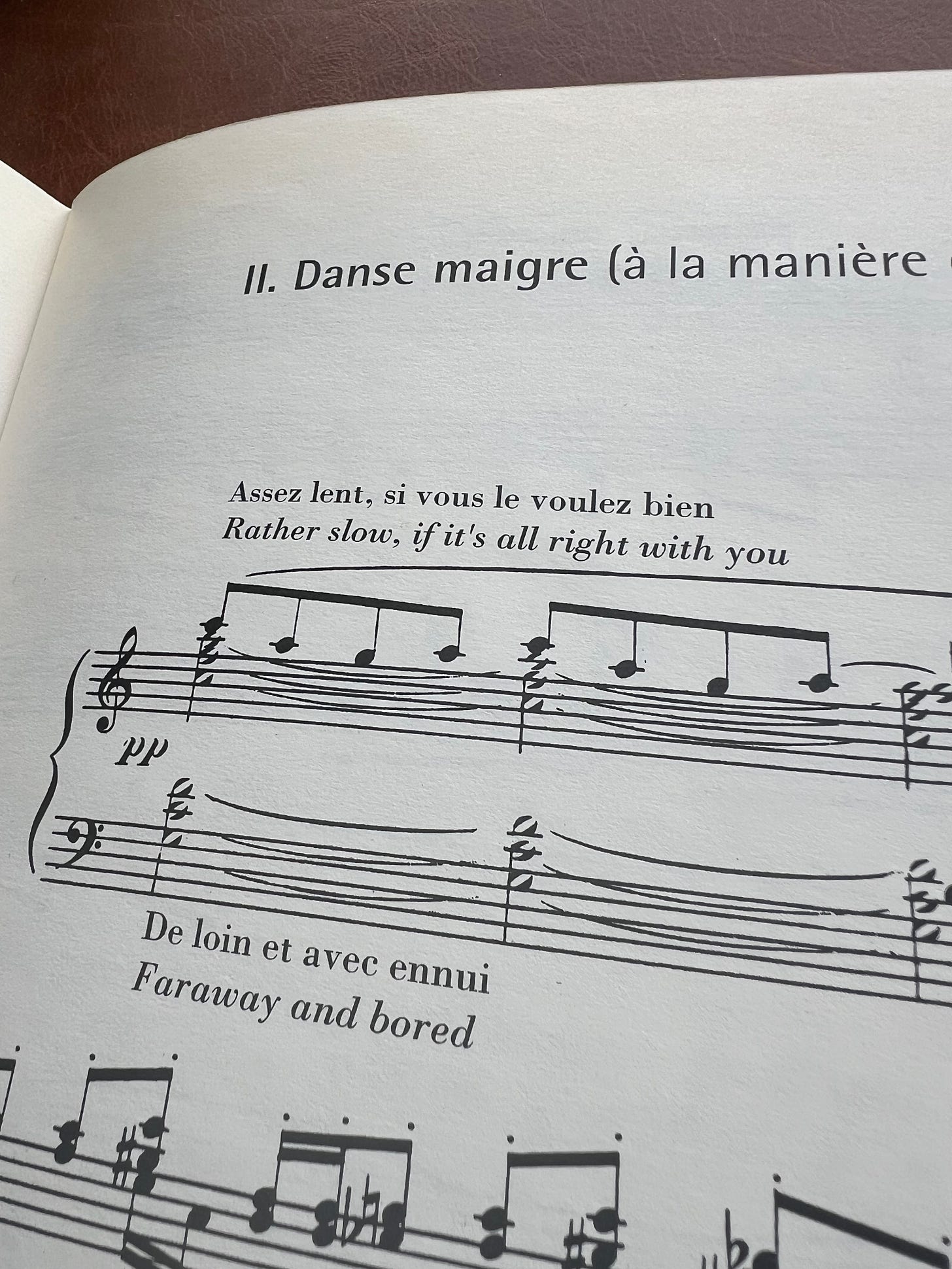 Part of a piano score by Erik Satie, with performance notations 'Rather slow, if it's alright with you' and 'Faraway and bored'