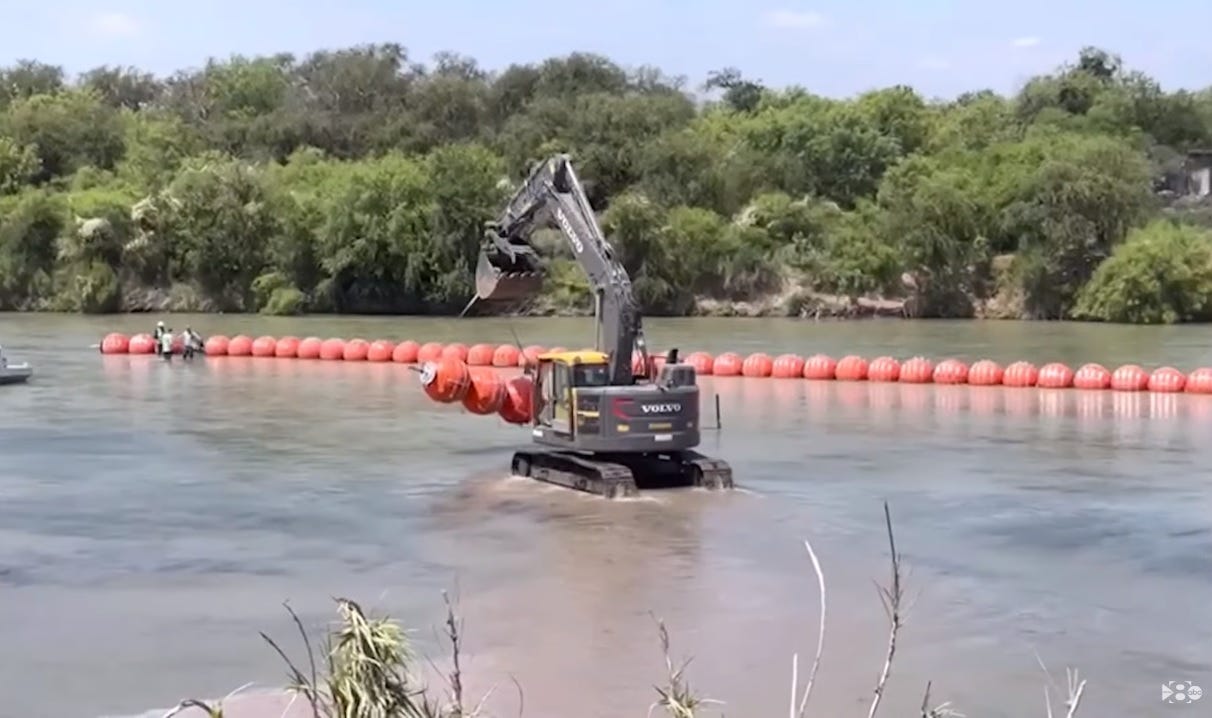 Border buoys being installed in the Rio Grande