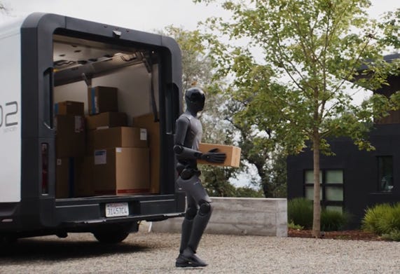 A humanoid robot carrying a box