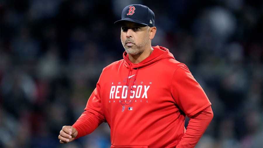 Boston Red Sox's manager Alex Cora heads back to the dugout after a visit to the pitcher's mound during the sixth inning of a baseball game against the Tampa Bay Rays at Fenway Park, Wednesday, Sept. 27, 2023, in Boston.