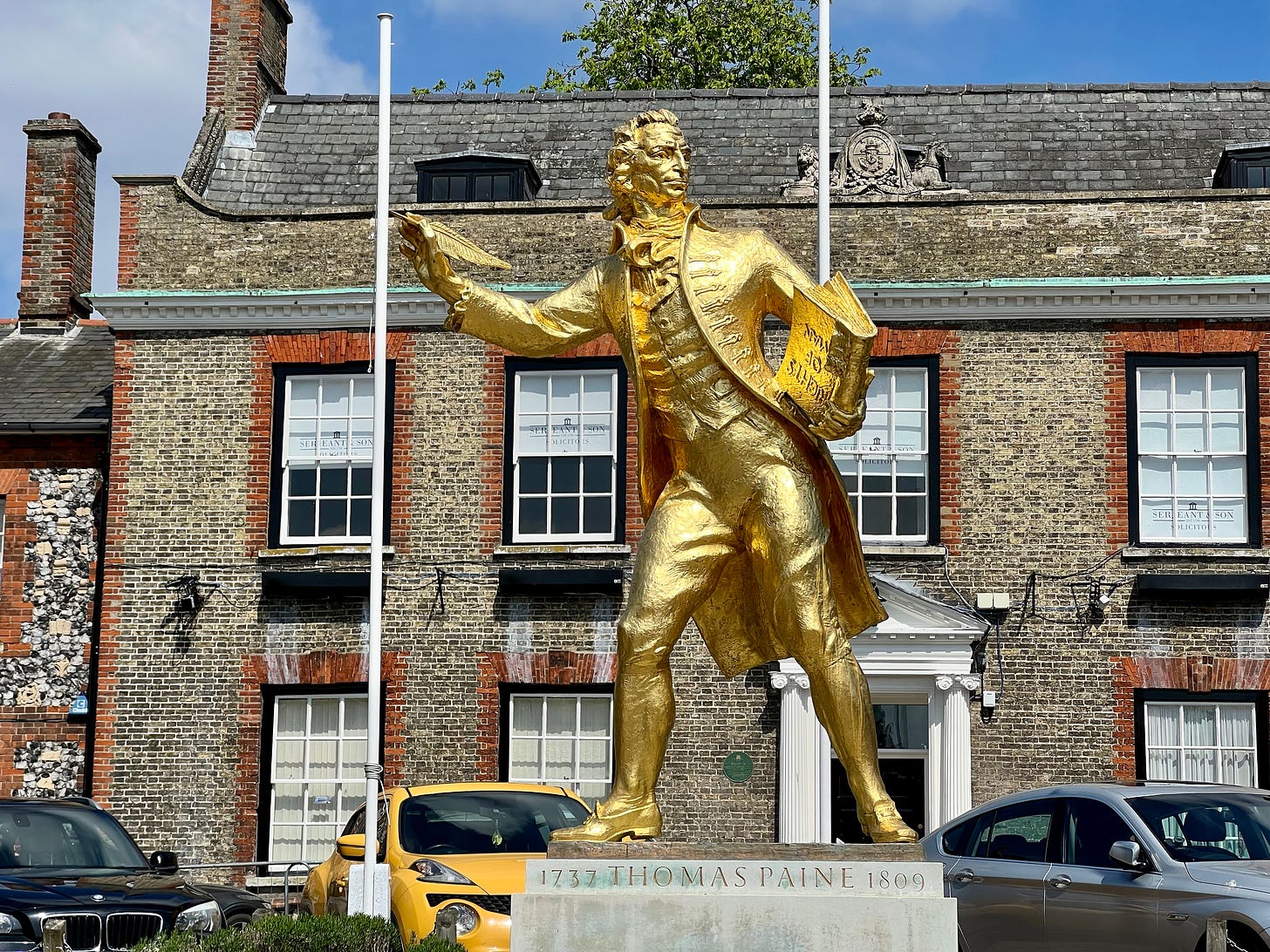 A golden statue of Tom Paine photographed in his birthplace of Thetford.