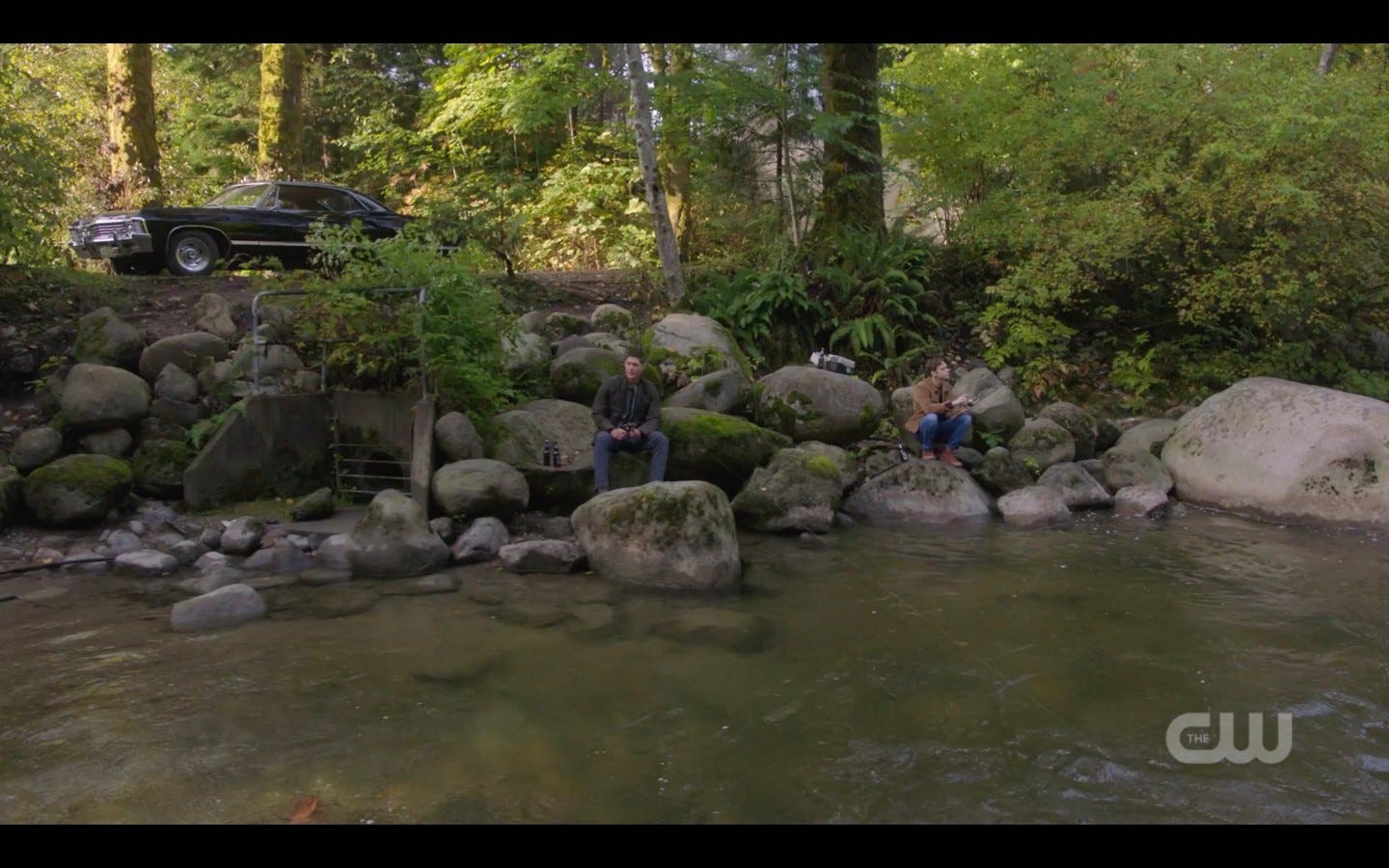 jack and dean winchester on rocks at river spn 1407