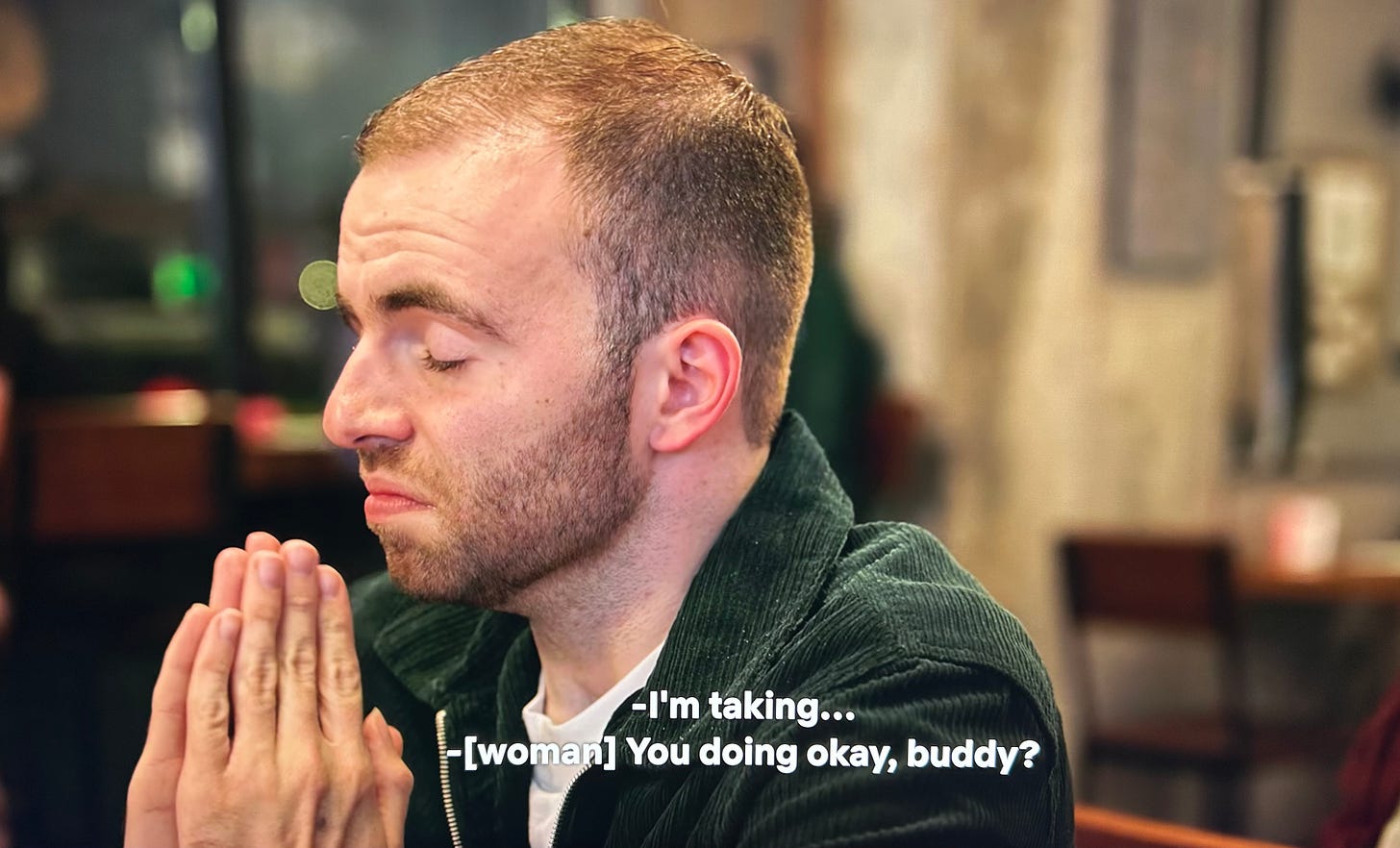 A screenshot of Connor at the speed dating event, with captions asking if he's doing okay and calling him buddy.