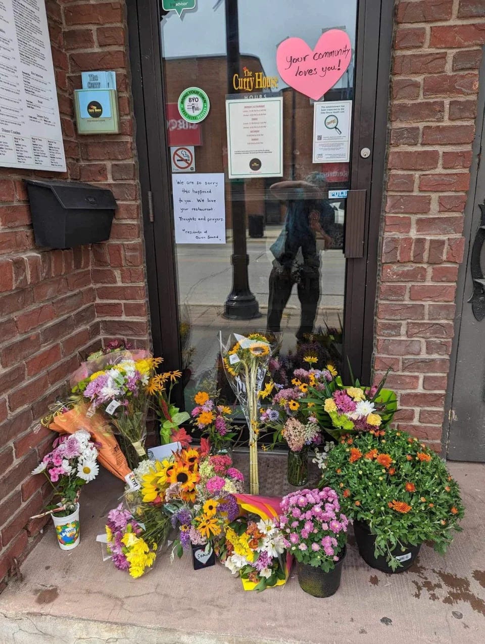 A makeshift shrine as well as messages of support and love have appeared on the doorstep of The Curry House since Rhaman was brutally beaten on Aug. 17, 2023.