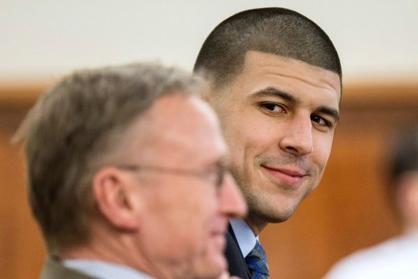 aaron hernandez smiling with attorney for guilty verdict 2015