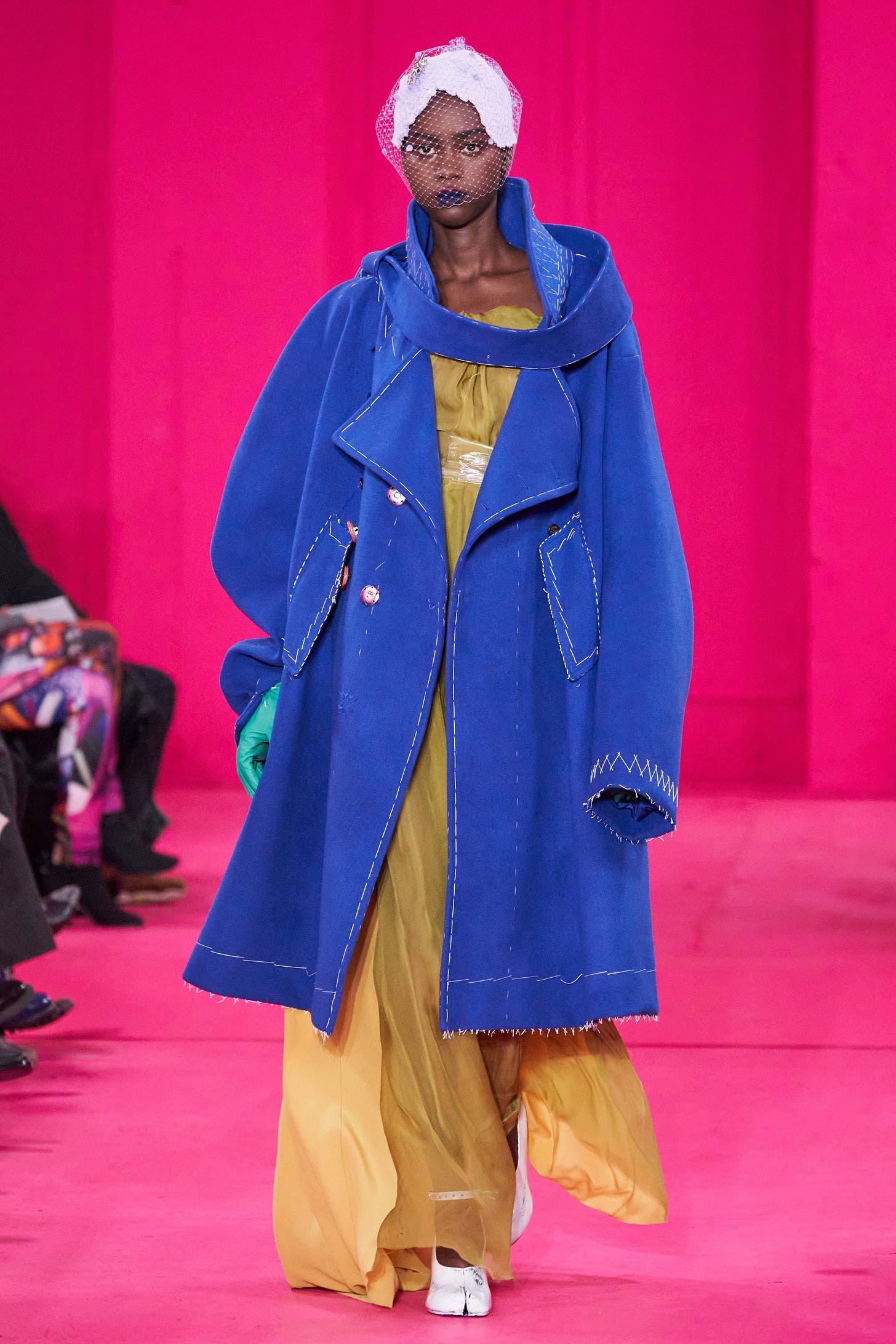 Image may contain Clothing Coat Apparel Overcoat Human Person Sleeve and Fashion