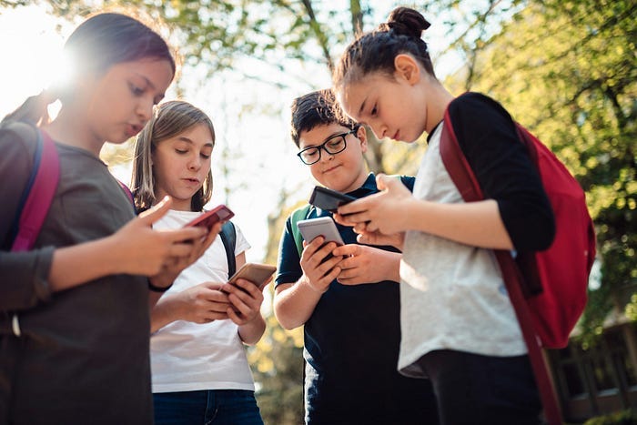Kids on smartphones. Kids on smartphones.