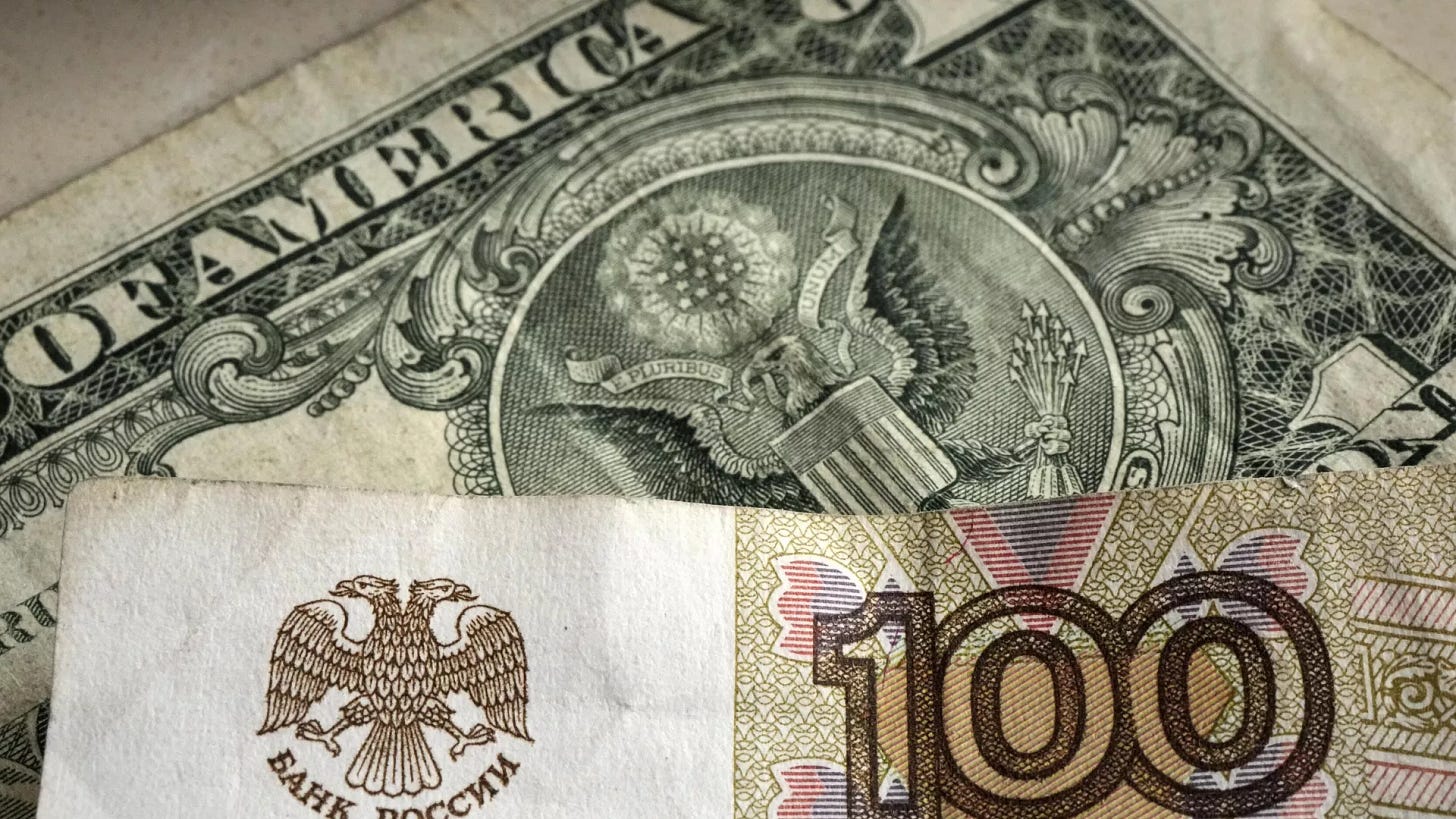 One hundred rubles banknote is pictured in front of a one US dollar banknote, Gelsenkirchen, Germany, Monday, April 25, 2022.  - Sputnik International, 1920, 31.05.2024