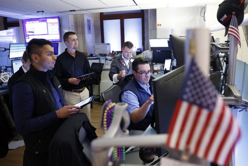 Traders work on the floor of the New York Stock Exchange on Wall Street in New York City in July. On Monday, major online brokerage companies' platforms were down for several hours amid a global stock market outage, according to Downdetector.com. File Photo by John Angelillo/UPI