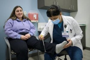 Primary Prevention trial participant Hannah Richardson, 24, undergoes a clinical exam given by WashU Medicine neurologist Nupur Ghoshal, MD, PhD. The international trial, led by WashU Medicine, aims to determine whether stopping the early molecular changes that lead to symptomatic Alzheimer’s disease can prevent the disease from ever taking hold.