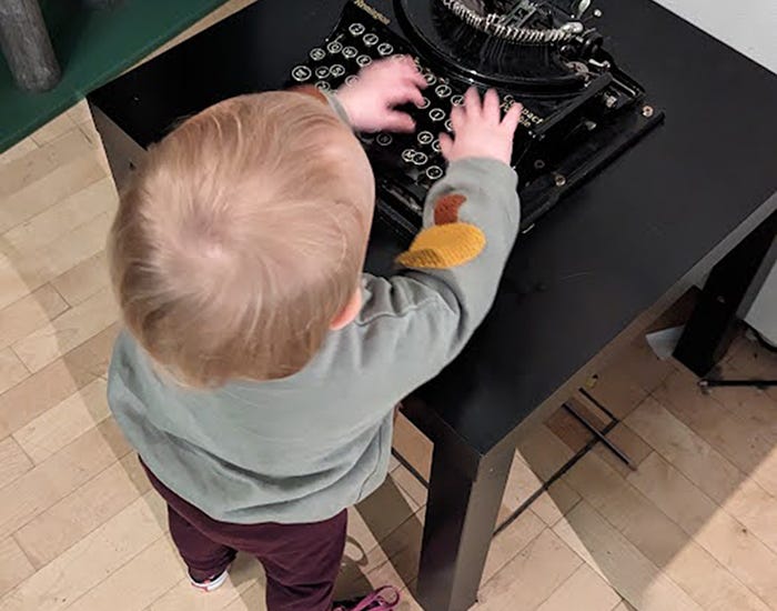 Baby at a typewriter