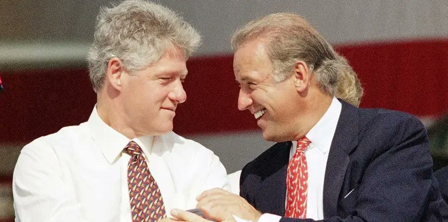Bill Clinton and Joe Biden in the '90s shaking hands but there's a lady behind Biden and her hair makes it look like he has a mullet
