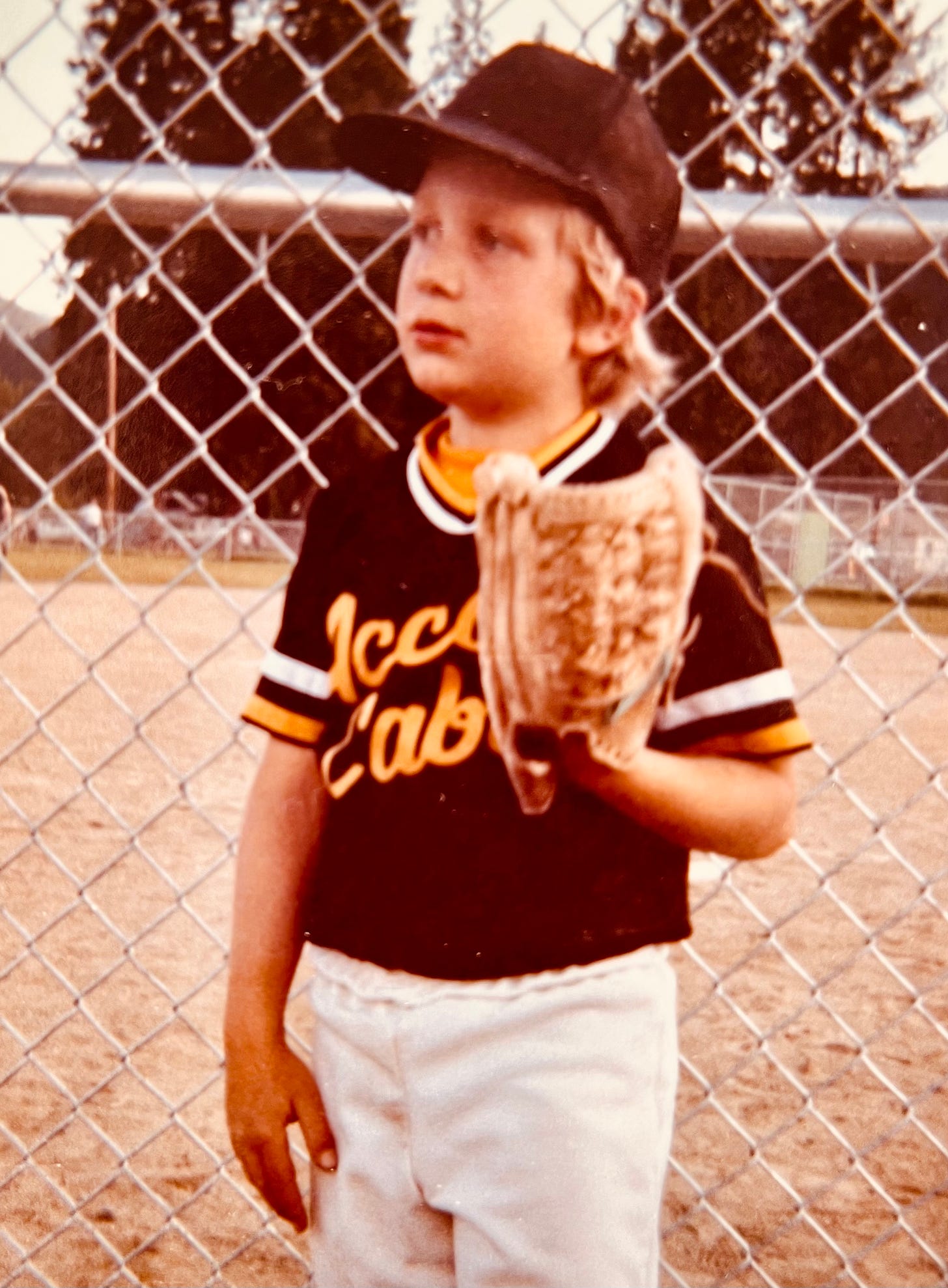 boy in baseball uniform