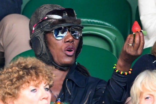 Grace Jones eats a strawberry at day two of the Wimbledon Tennis Championships