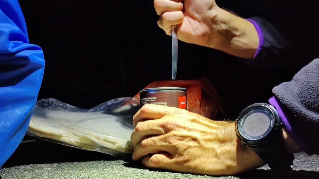 Opening a can of beans using a fork handle