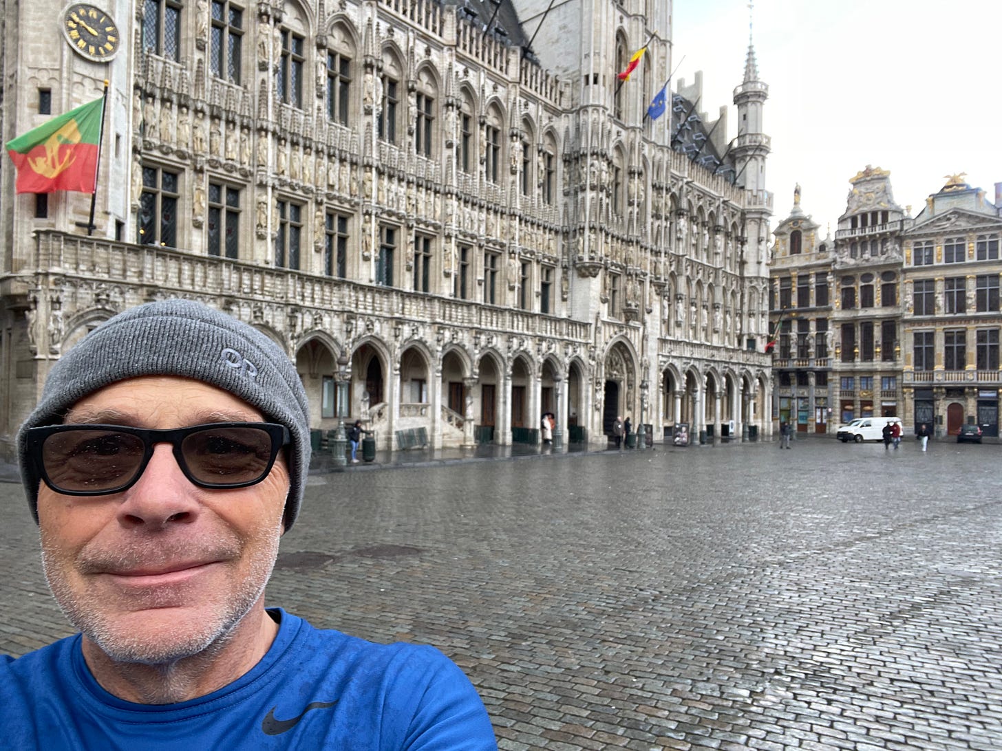 Pausing on a cold wet morning during a run-see in Grand-Place de Bruxelles