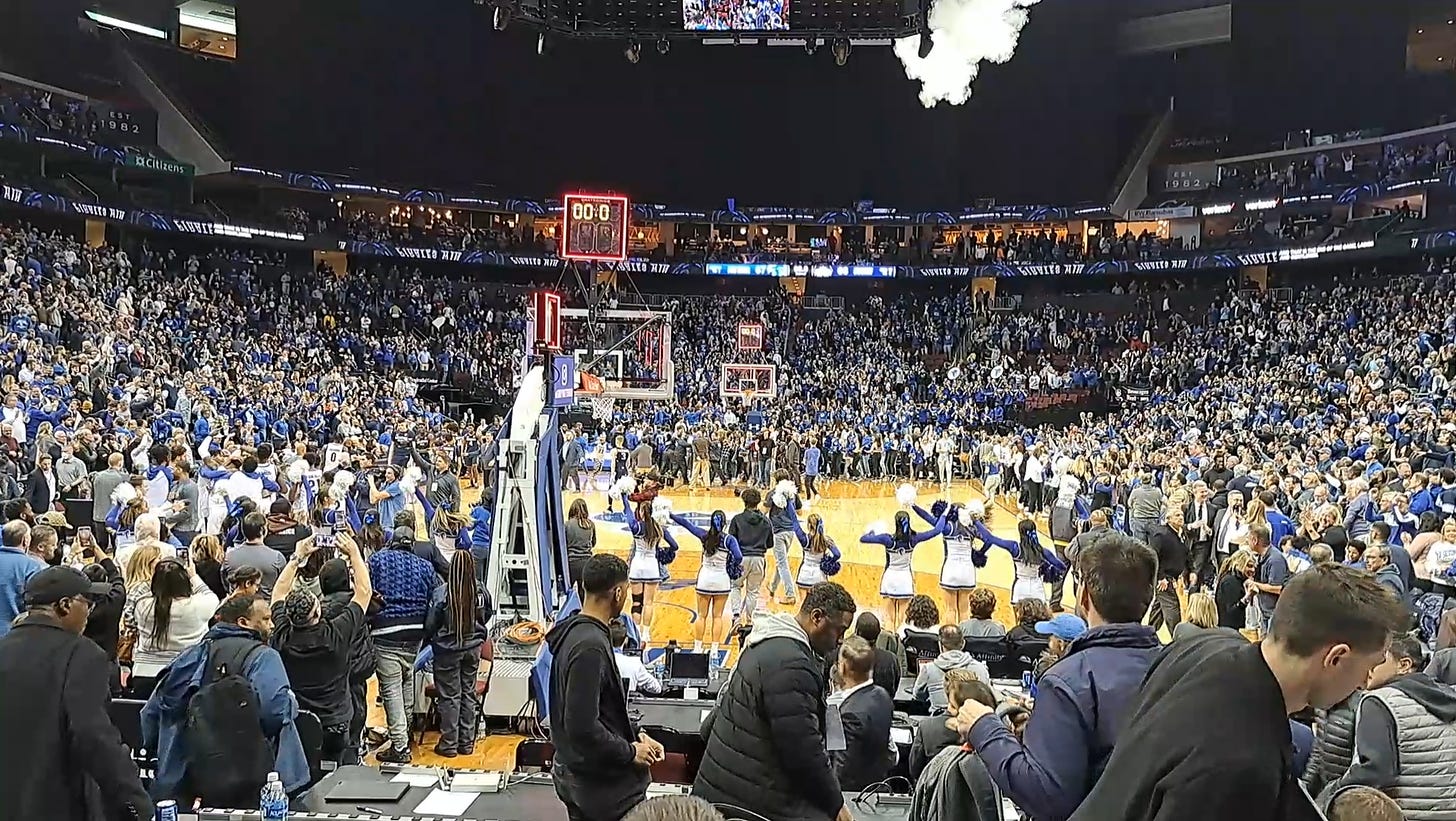 Fans begin to storm the court at the Prudential Center following Seton Hall’s 67-66 upset of No. 15 UConn on Jan. 18, 2023. (Photo by Adam Zielonka)