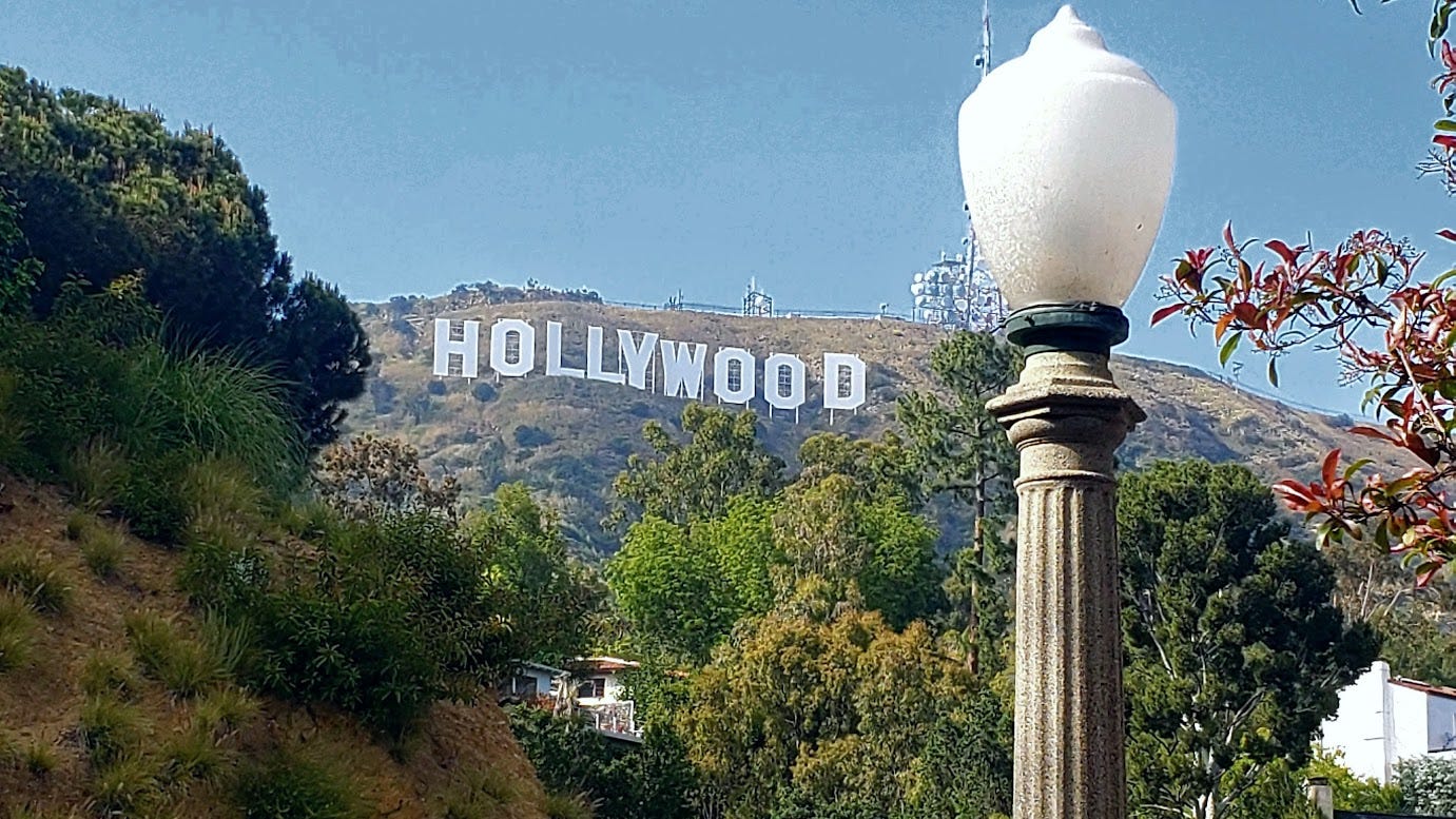 Hollywood sign seen from the middle distance, low angle