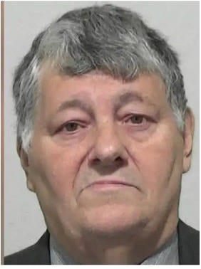 A person with grey hair

Description automatically generated