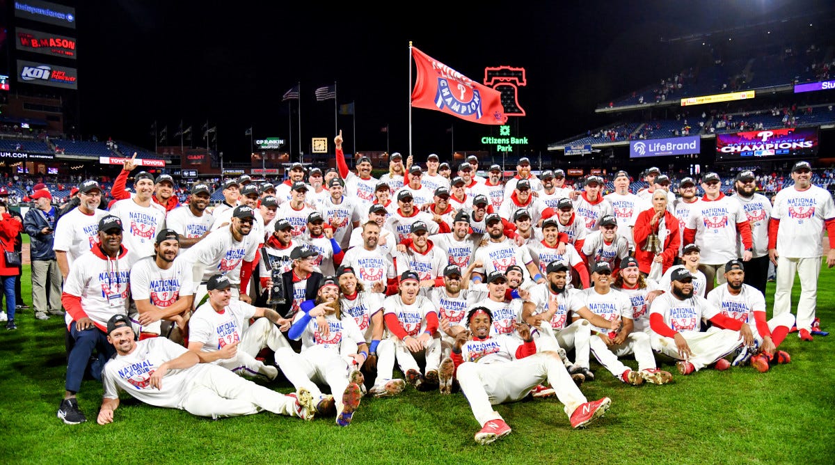 Phillies players pose for a team photo after winning the National League pennant to advance to the World Series.