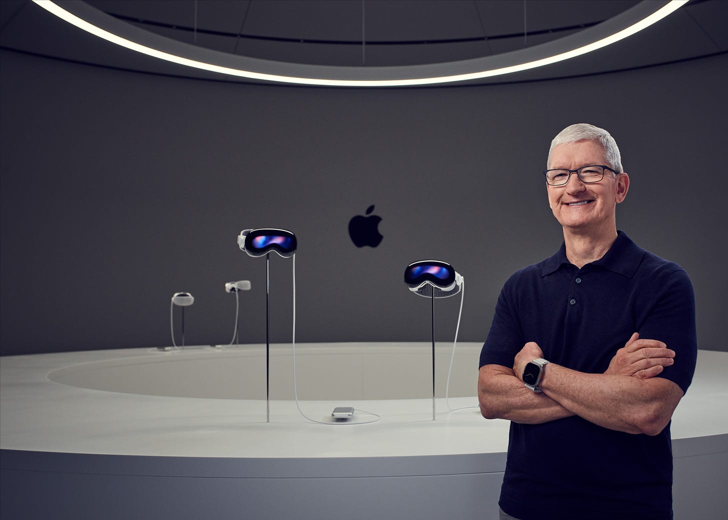 Tim Cook standing next to Apple Vision Pro