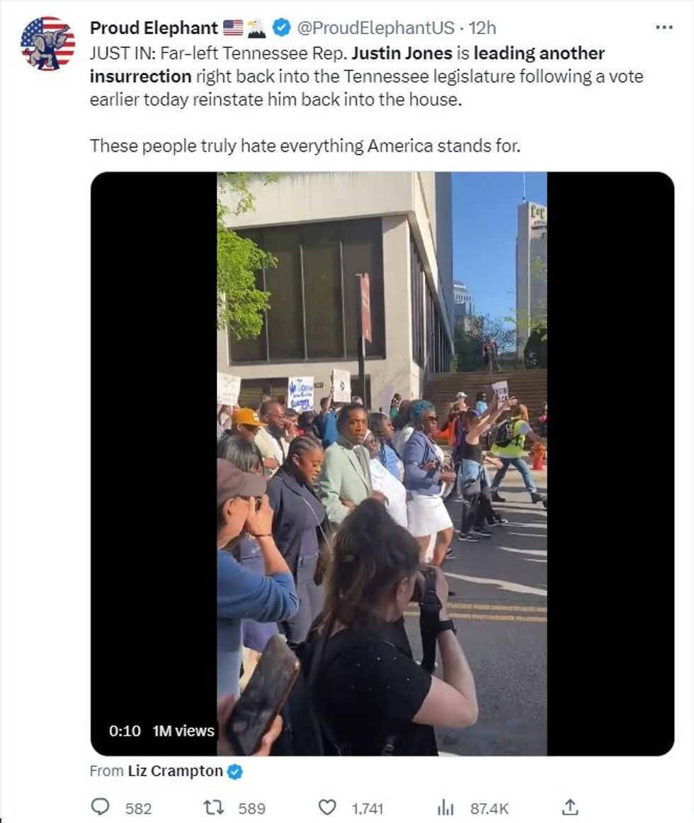 Tweet from a rightwing account: Video of Justin Jones and supporters marching to the Tennessee Capitol for his swearing-in, with caption "JUST IN: Far-Left Tennessee Rep. Justin Jones is leading another insurrection right back into the Tennessee legislature following a vote earlier today to reinstate him back into the house.  These people truly hate everything America stands for" 