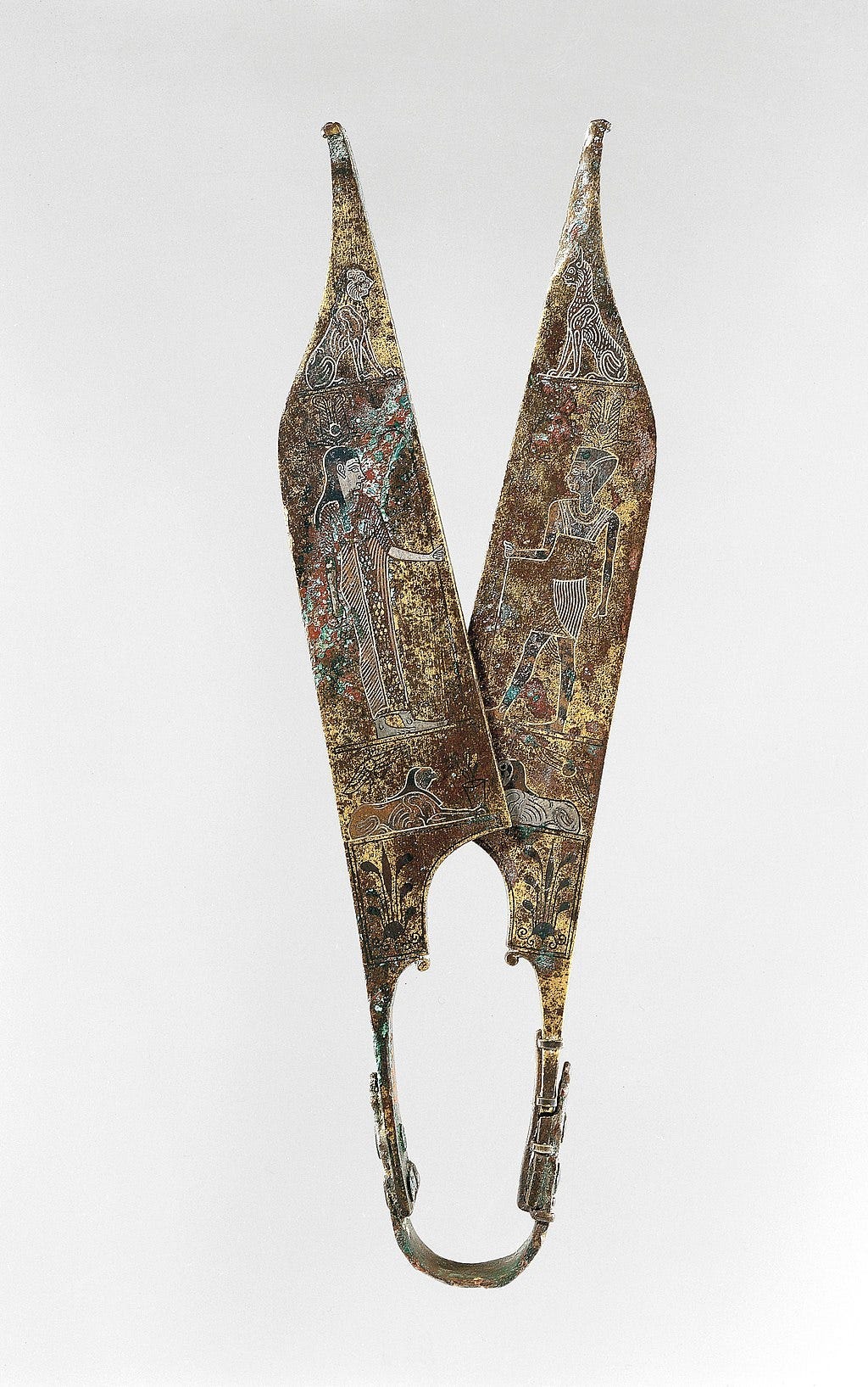 Scissors from Ancient Egypt with various colorful images dating back to the 5th millennium BC