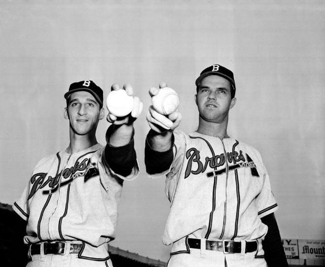 Warren Spahn (left) and Johnny Sain (right) were one of the most fabled pitching tandems when they started for the Boston Braves from 1946-1951. Sain died Tuesday; Spahn died in 2003.