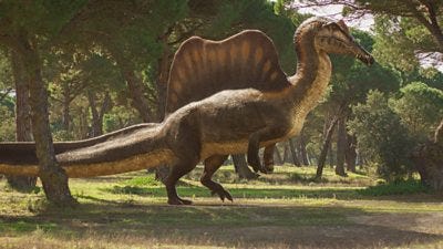 A large dinosaur with a spiny back and long tail runs on two legs through a clearing in a grassy forest 