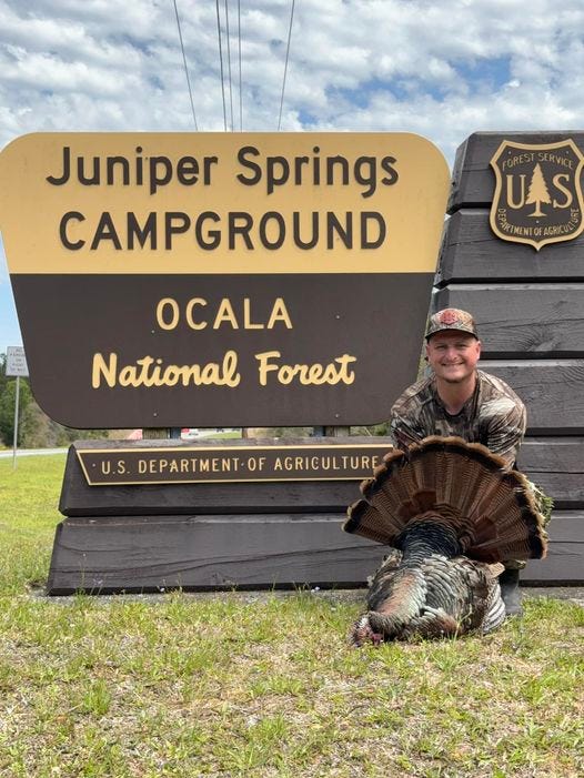 May be an image of 1 person, grouse and text that says 'Juniper Springs CAMPGROUND FTSER SERVICE UAS MENTOFAGRICUL OCALA National Forest U.S. DEPARTMENT OF AGRICULTURE'