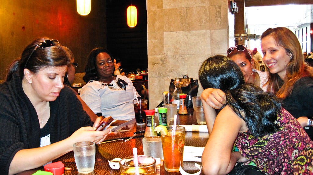 women at table talking