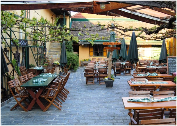 The courtyard of Mayer am Pfarrplatz with the steps leading to Beethoven's apartment.