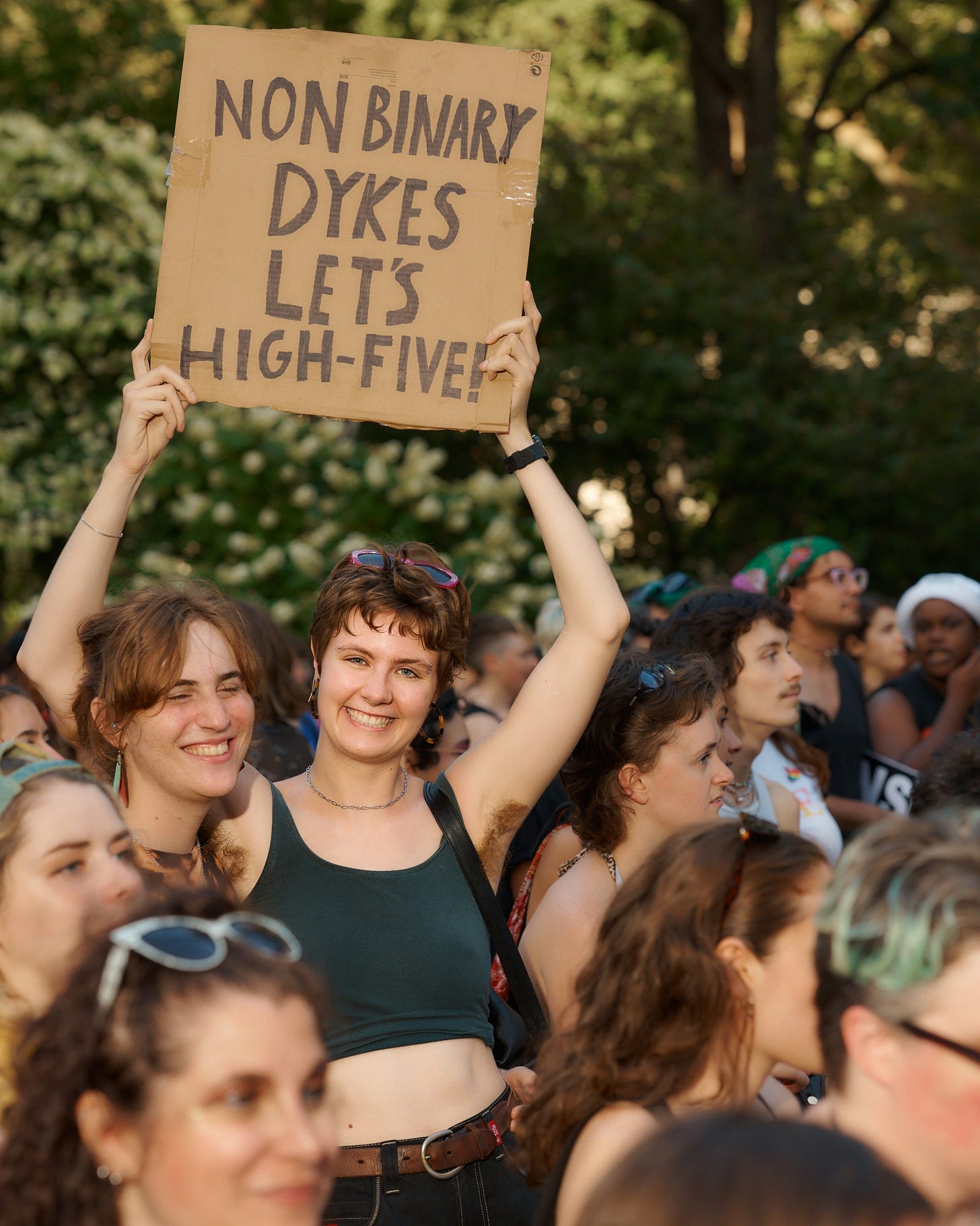 Sign: Nonbinary Dykes, let's high five by Yael Malka