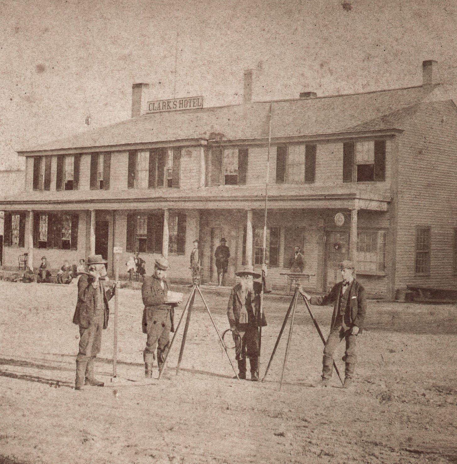 Clark hotel with surveyors in foreground