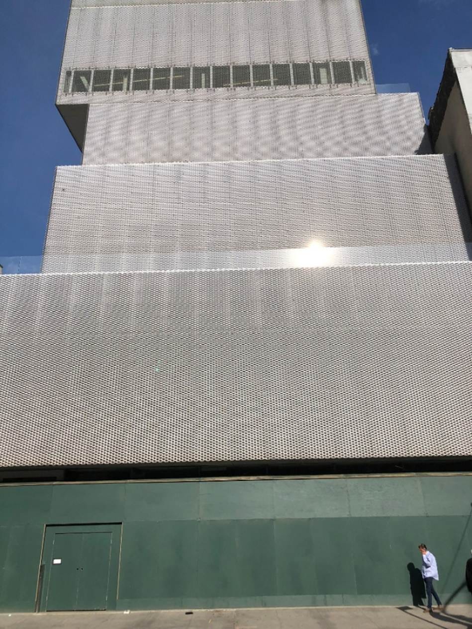 A building with a green wall

AI-generated content may be incorrect.