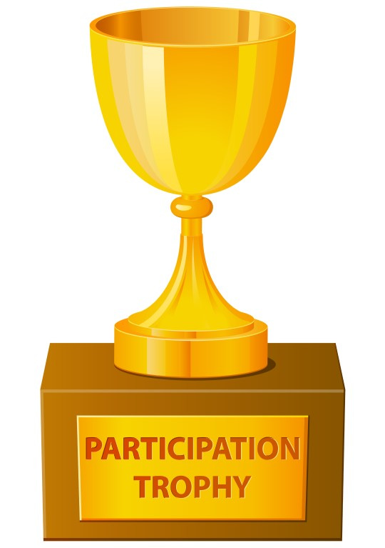 Golden, cup-shaped trophy on a wooden base, with "PARTICIPATION TROPHY" on the name plate.