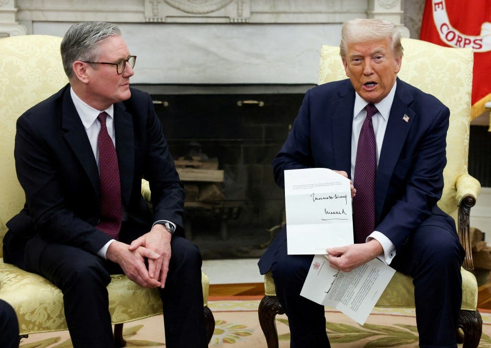 President Trump holding a letter from King Charles while meeting with British Prime Minister Keir Starmer.