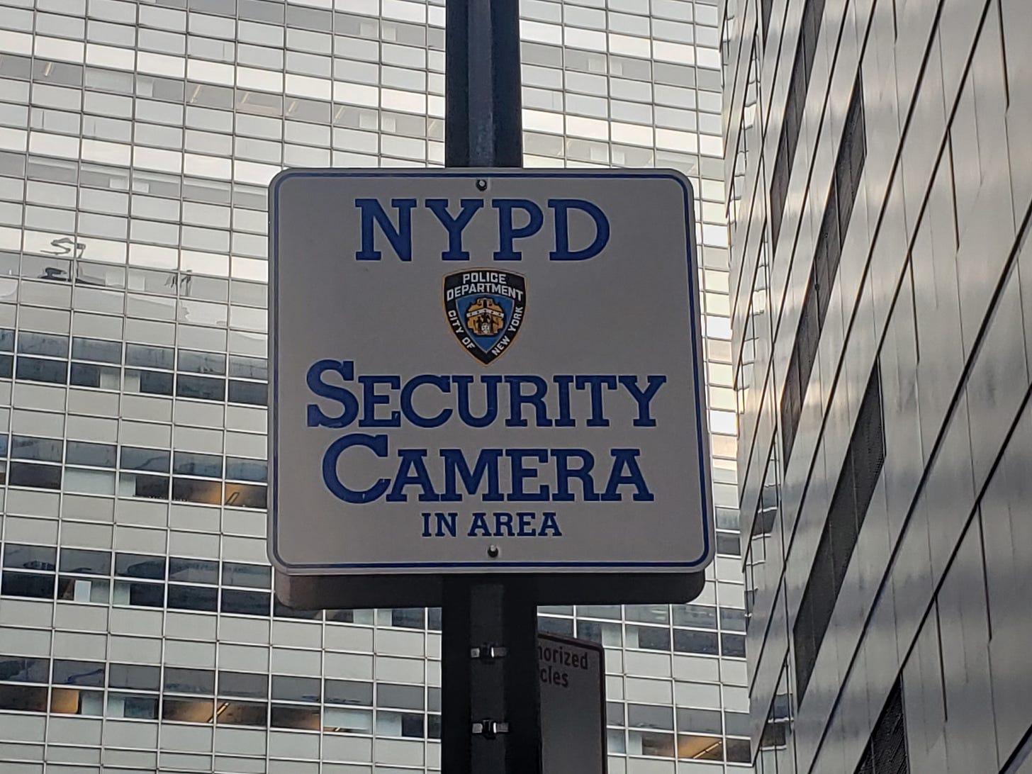 Sign stating "NYPD Security Camera In Area"