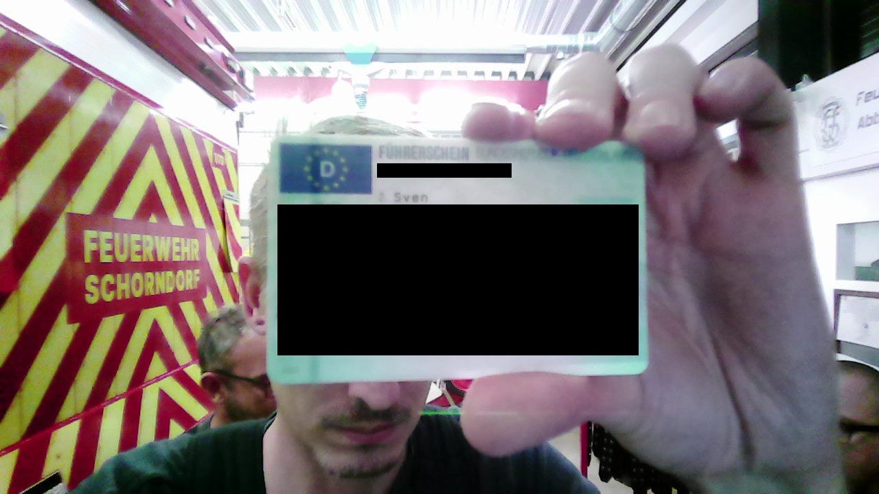 Redacted example of a Firefighter from Schorndorf holding his drivers licence.