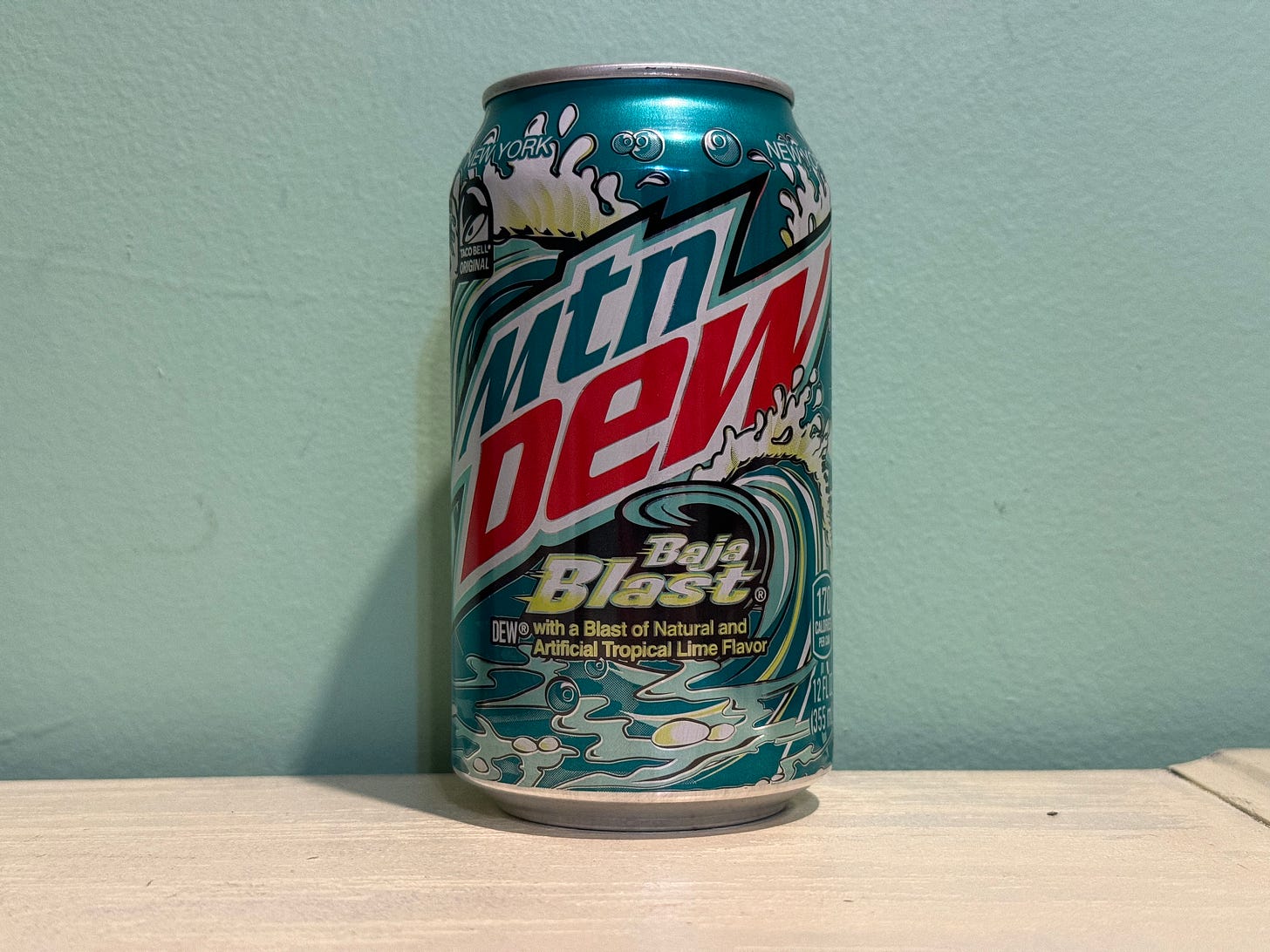 can of baja blast against a turquoise wall