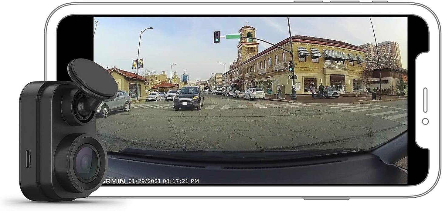 Interior view from dash cam with infrared night vision, clearly showing car cabin in low light