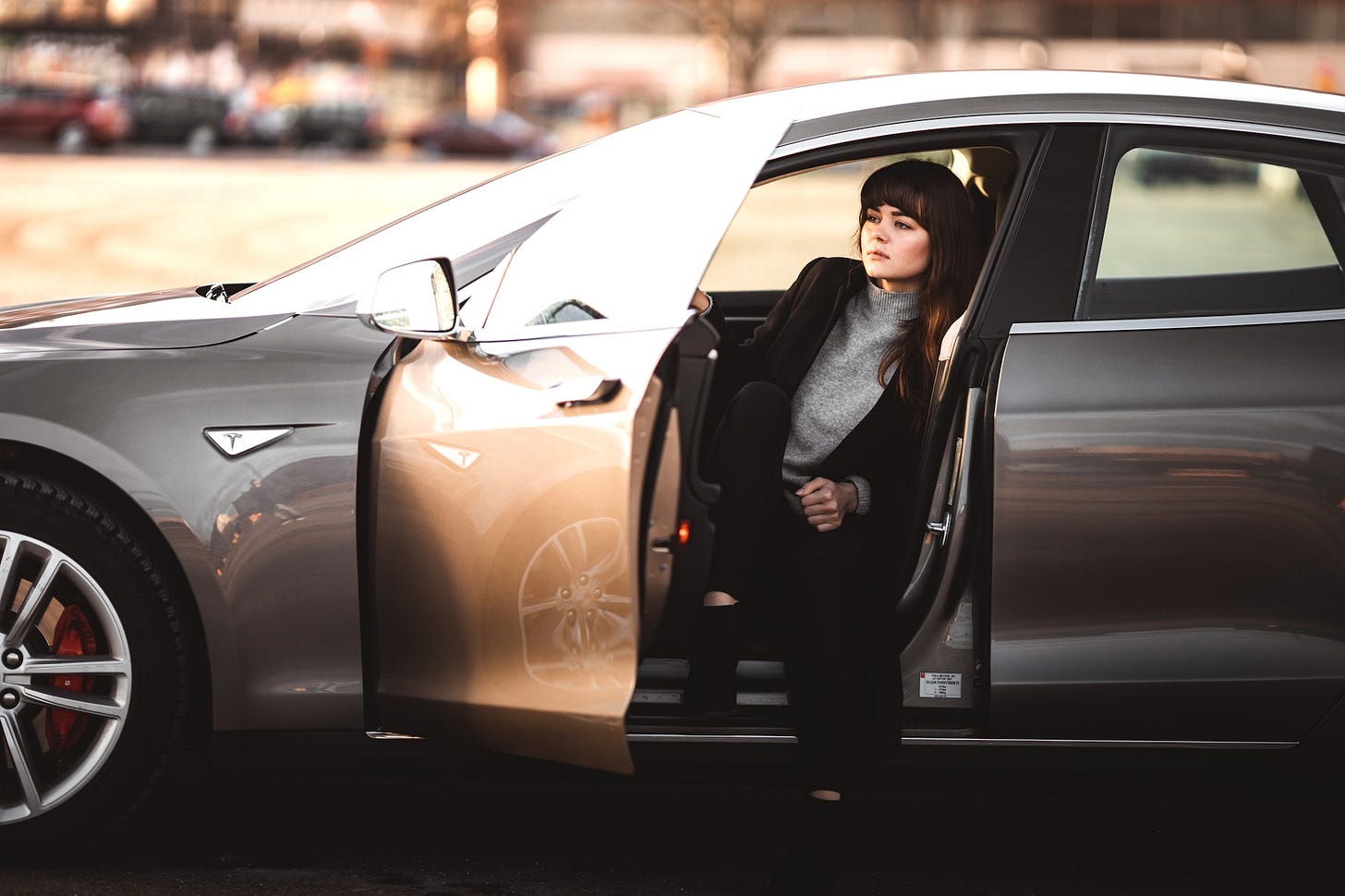 A girl in a Tesla